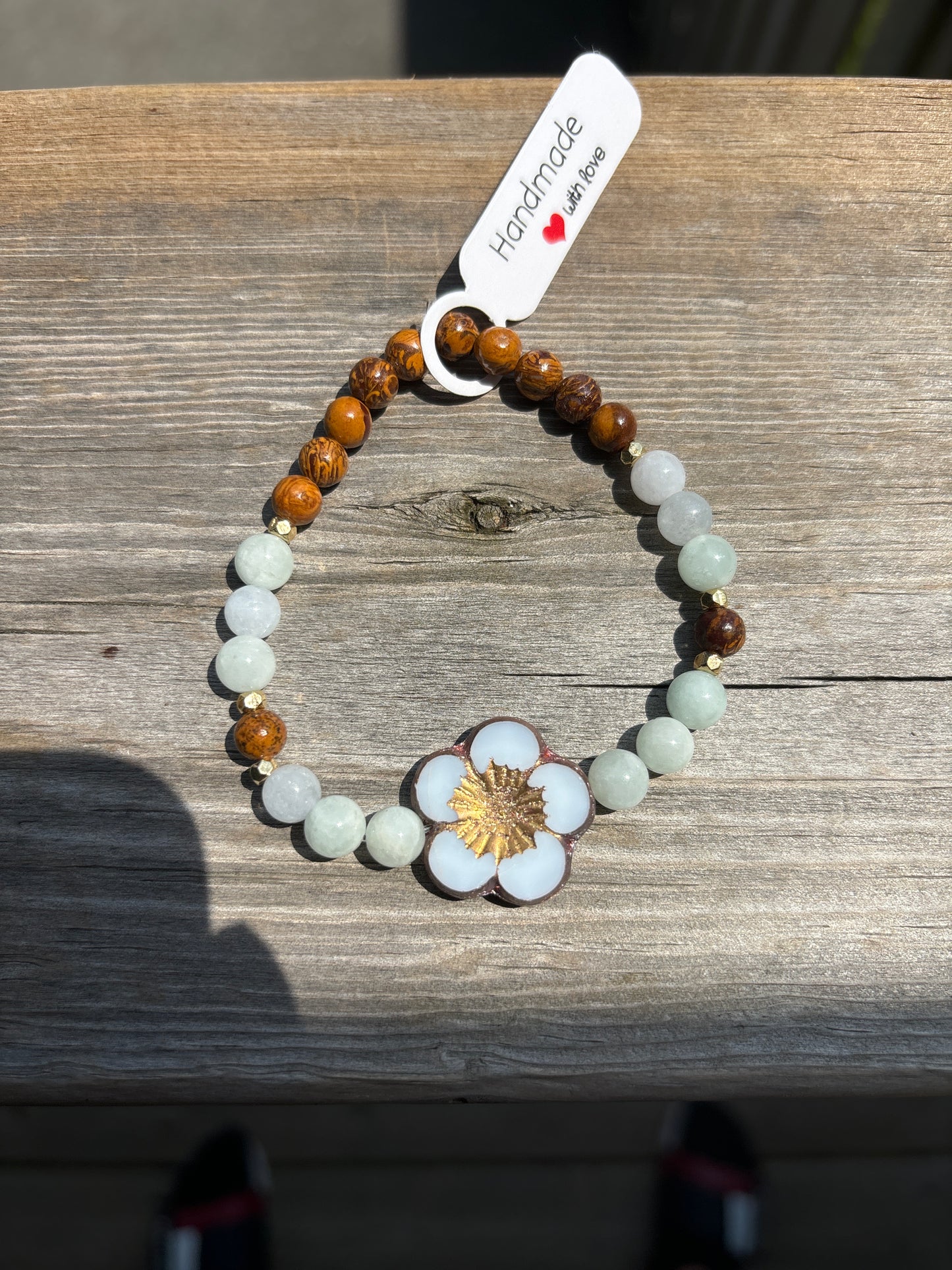 Aquamarine and elephant jasper crystal bracelet- 7”white with brass outline flower