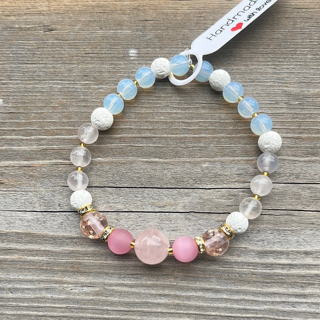 Rose Quartz, Cats Eye, Glow in dark glass, lava stone and Opalite crystal bracelet - 7”.