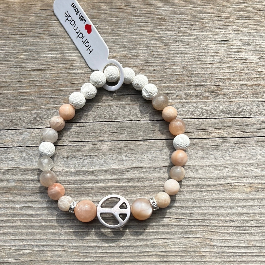 Sunstone and Lava Stone Crystal Bracelet - 7”. Peace sign