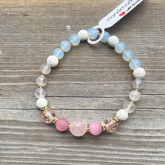 Rose Quartz, Cats Eye, Glow in dark glass, lava stone and Opalite crystal bracelet - 7”.