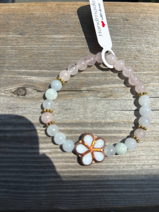 Aquamarine and rose quartz crystal bracelet- 7”. White/brass outline flower